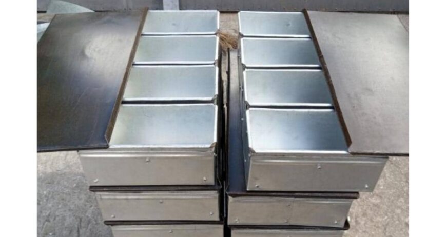 A heavy-duty, commercial-grade galvanized iron bread baking mold featuring a 4-pocket multi-loaf design and a sliding lid. Perfect for baking perfectly shaped, uniform sandwich bread or toast loaves in high volumes.