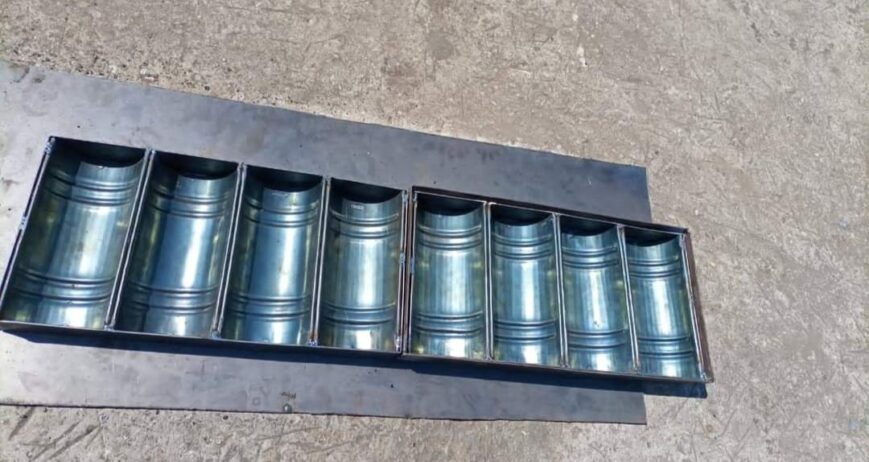 A commercial-grade, multi-slot corrugated baking mold designed for making rusk cake logs, long buns, or specialty breads. Features a curved, ribbed bottom design to create classic cylindrical slices.
