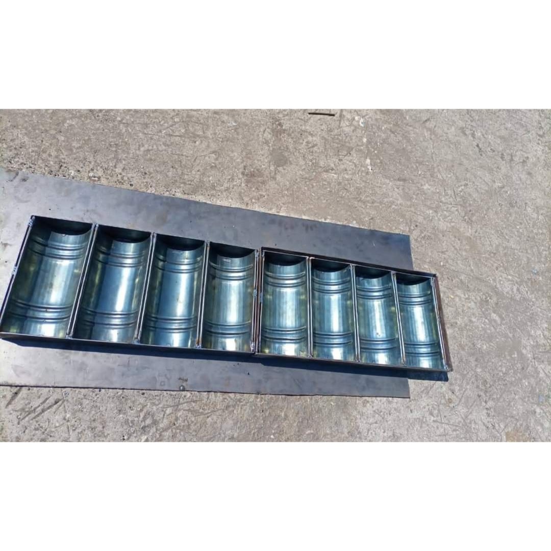 A commercial-grade, multi-slot corrugated baking mold designed for making rusk cake logs, long buns, or specialty breads. Features a curved, ribbed bottom design to create classic cylindrical slices.