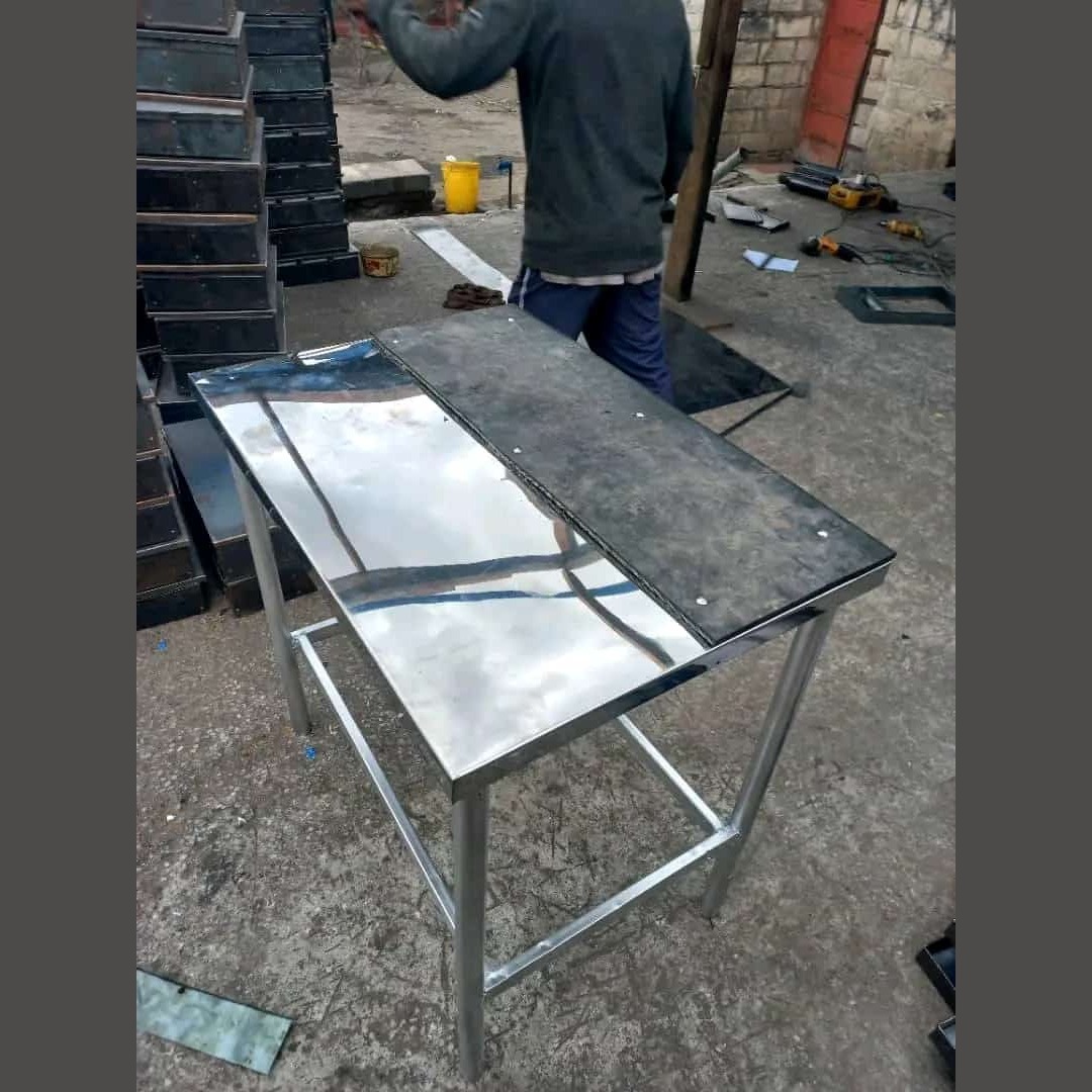 A commercial-grade stainless steel prep and work table featuring a reinforced top surface and a sturdy tubular underframe. Ideal for food preparation, dough kneading, and heavy-duty utility tasks in professional kitchens.