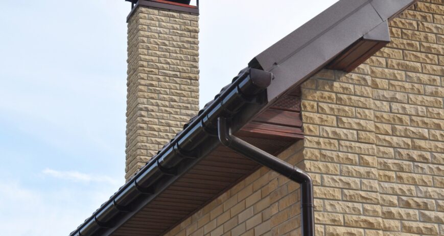 A durable metal rain gutter system designed for efficient roof drainage, protecting buildings from water damage while providing a clean and modern appearance.