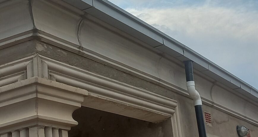 A high-quality aluminum roof gutter system designed to efficiently collect and channel rainwater, protecting buildings from water damage while maintaining a clean and modern appearance.